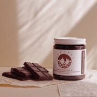 jar of cacao ghee with chocolate squares