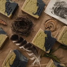 bars of soap with a nest, feather, and cedar