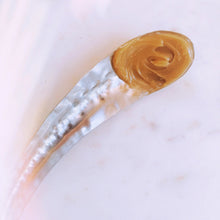 ghee on a silver spoon