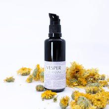 Vesper Cleansing Oil on a white background with calendula flowers surrounding it