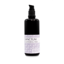 Bottle of Sanctum Cleansing Milk on white background